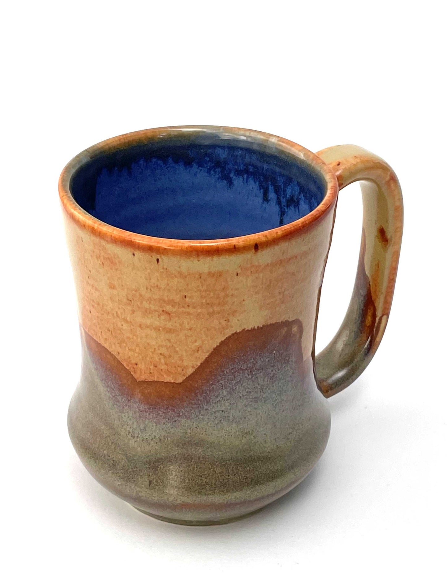 Ceramic mug with a blue interior, and orange, purple and green exterior
