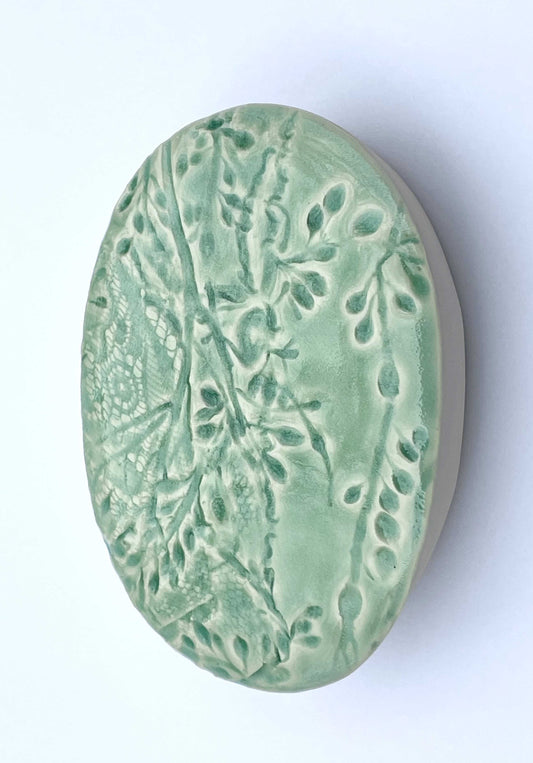 Green ceramic oval with seaweed pattern