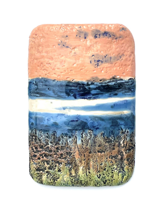 vertical rectangular porcelain wall-hung decorative tile with coral, blue, white and green glazes and a textured surface, representing an abstract river scene