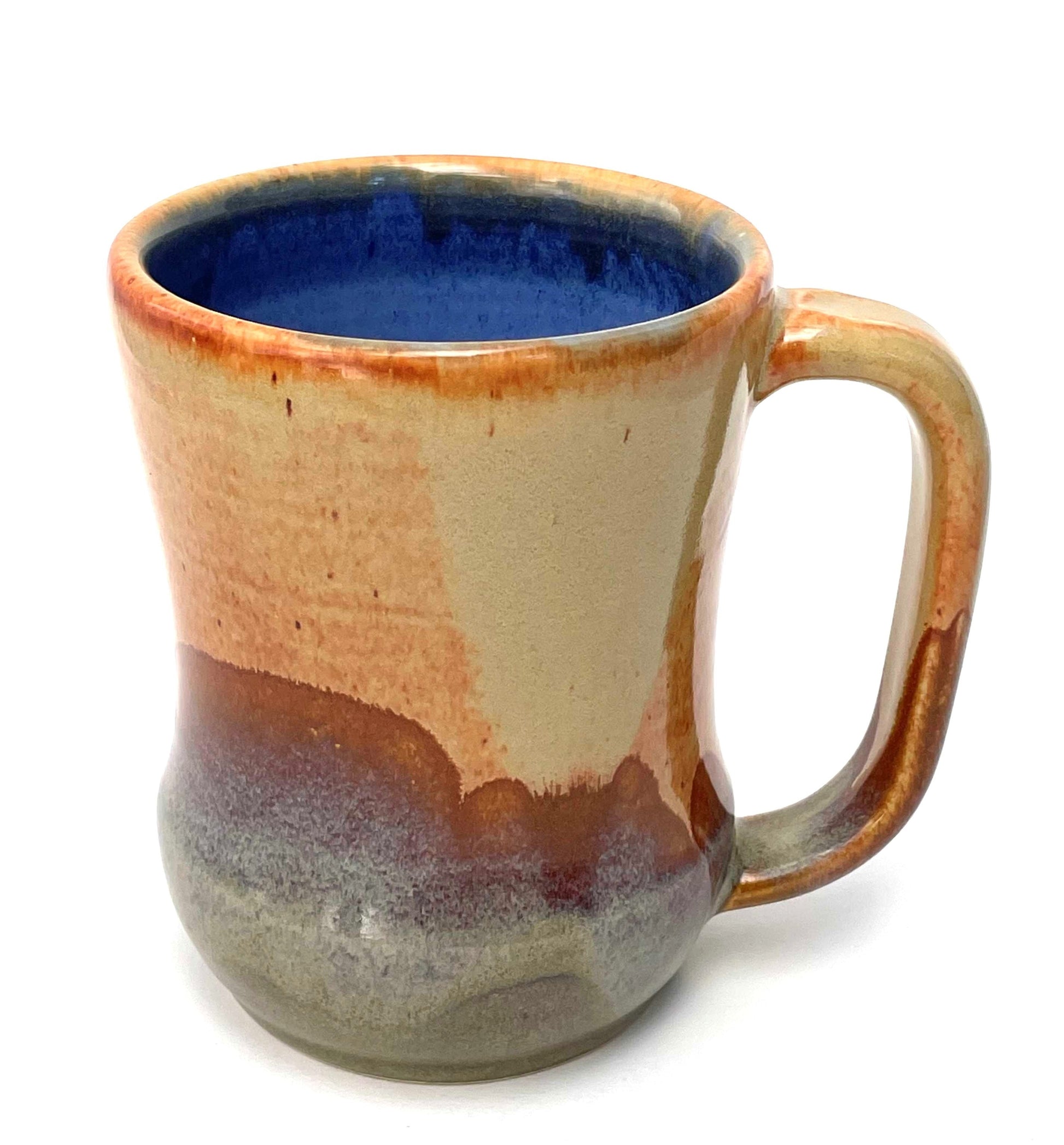 Ceramic mug with multicolored glaze on a white background