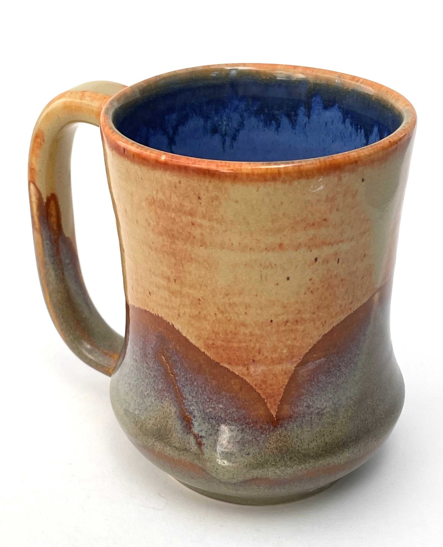Ceramic mug with a blue interior, and orange, purple and green exterior