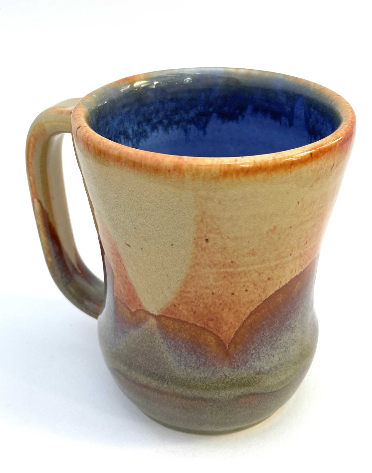 Ceramic mug with a blue interior, and orange, purple and green exterior